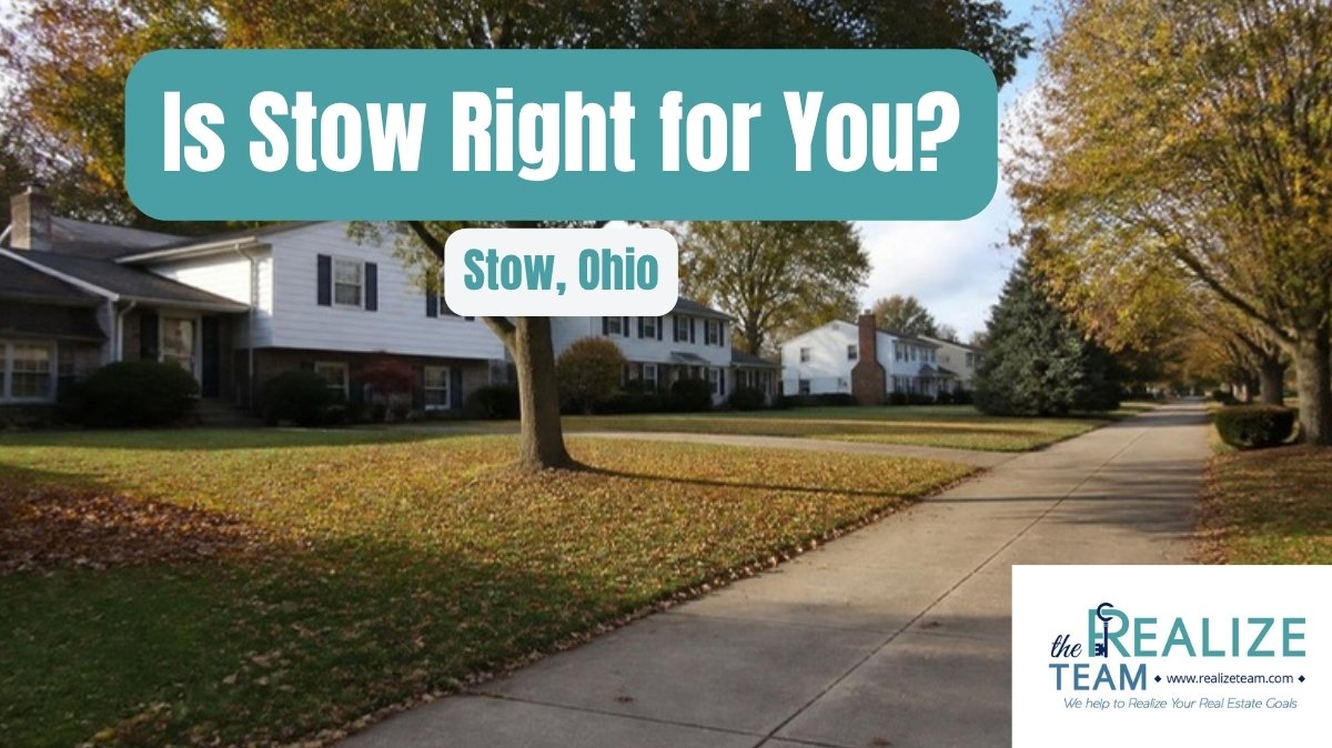 Tree lined residential street of colonial and split level homes in early fall