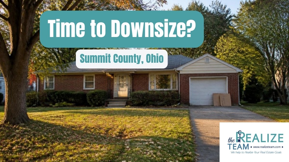 Brick ranch home with a two car driveway and moving boxes by the garage on a tree lined Summit County, Ohio street, with the headline Time to Downsize?