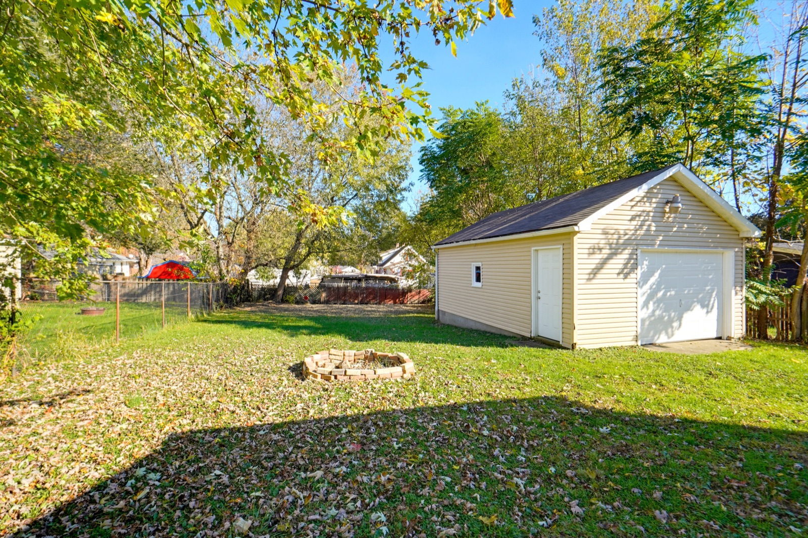 Backyard with fire pit and garage