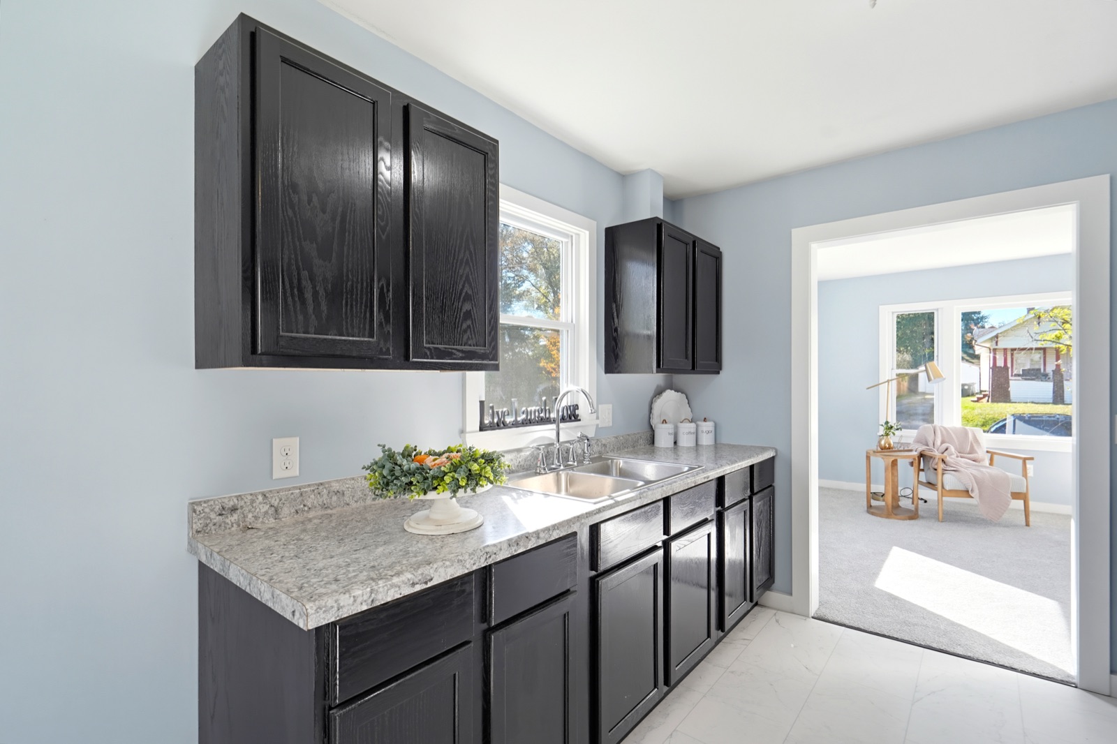 Kitchen with new stainless refrigerator